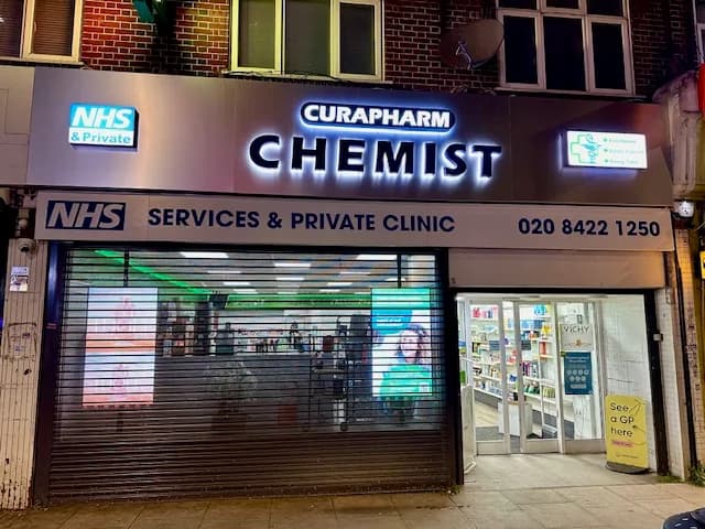 CuraPharm Chemist storefront at night, Sudbury Hill